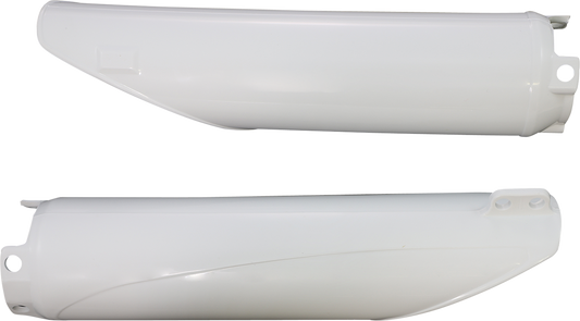 White Acerbis lower fork covers for motorcycle suspension, shown on a bike body with mounting details.