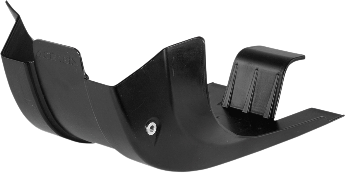 Black ACERBIS MX skid plate for motorcycle, designed for body protection, displayed on a bike in a natural riding environment.