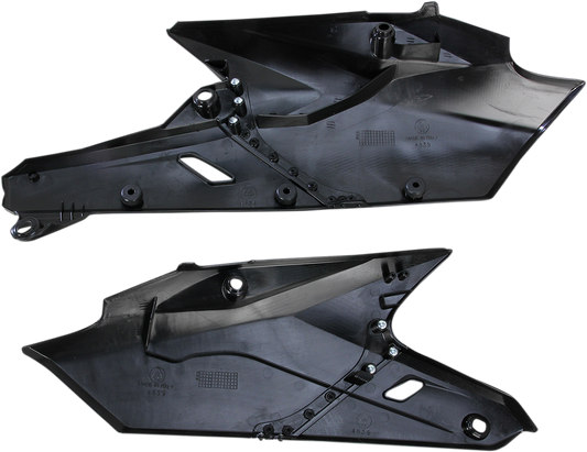 Black Acerbis side panels for motorcycle body, designed for durability and style, shown on a motorcycle in this image.