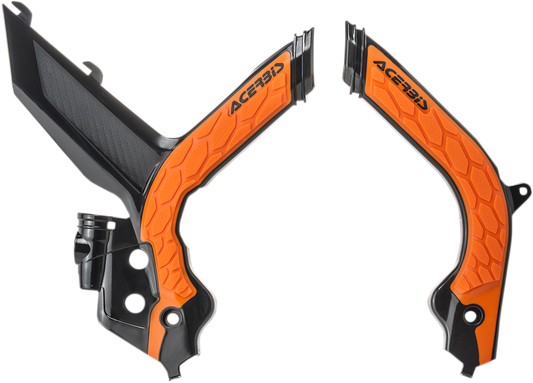 Acerbis X-Grip frame guards in black and orange for motorcycle, designed for durable protection and a sleek look.