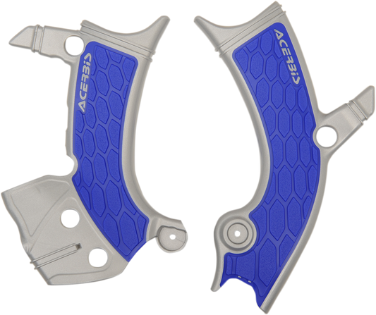 Acerbis X-Grip frame guards in silver and blue installed on a motorcycle body, providing protection and style.