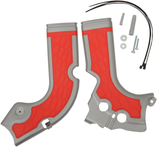 Acerbis X-Grip motorcycle frame guards in silver and red, mounted on a bike's body for protection and style.