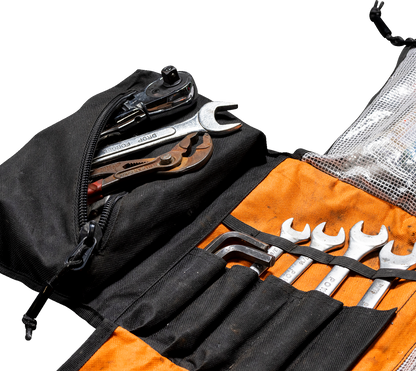 Black Biltwell Exfil-0 2.0 tool roll with multiple compartments, designed for motorcycle tool storage by Bill's Exhausts.