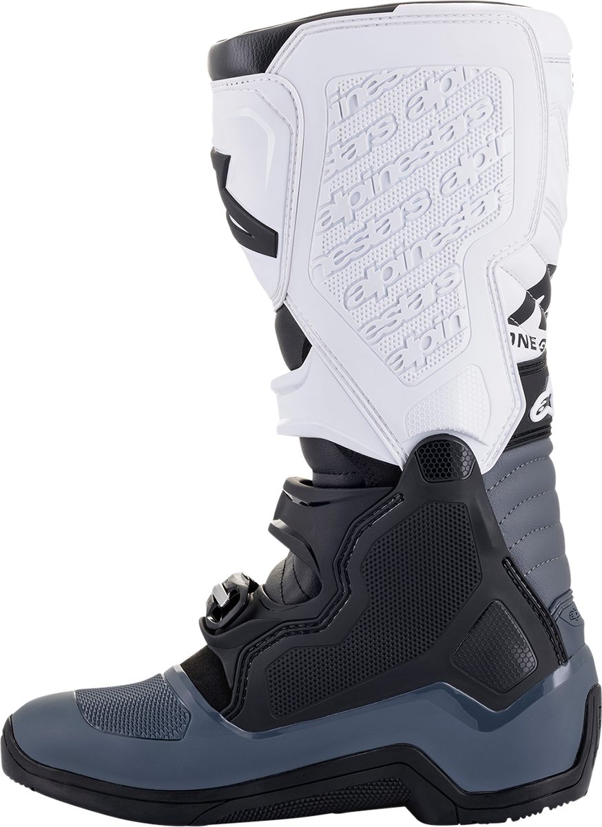 Alpinestars Tech 5 motorcycle boots in black and white, US 13 size, with protective design and sturdy sole.