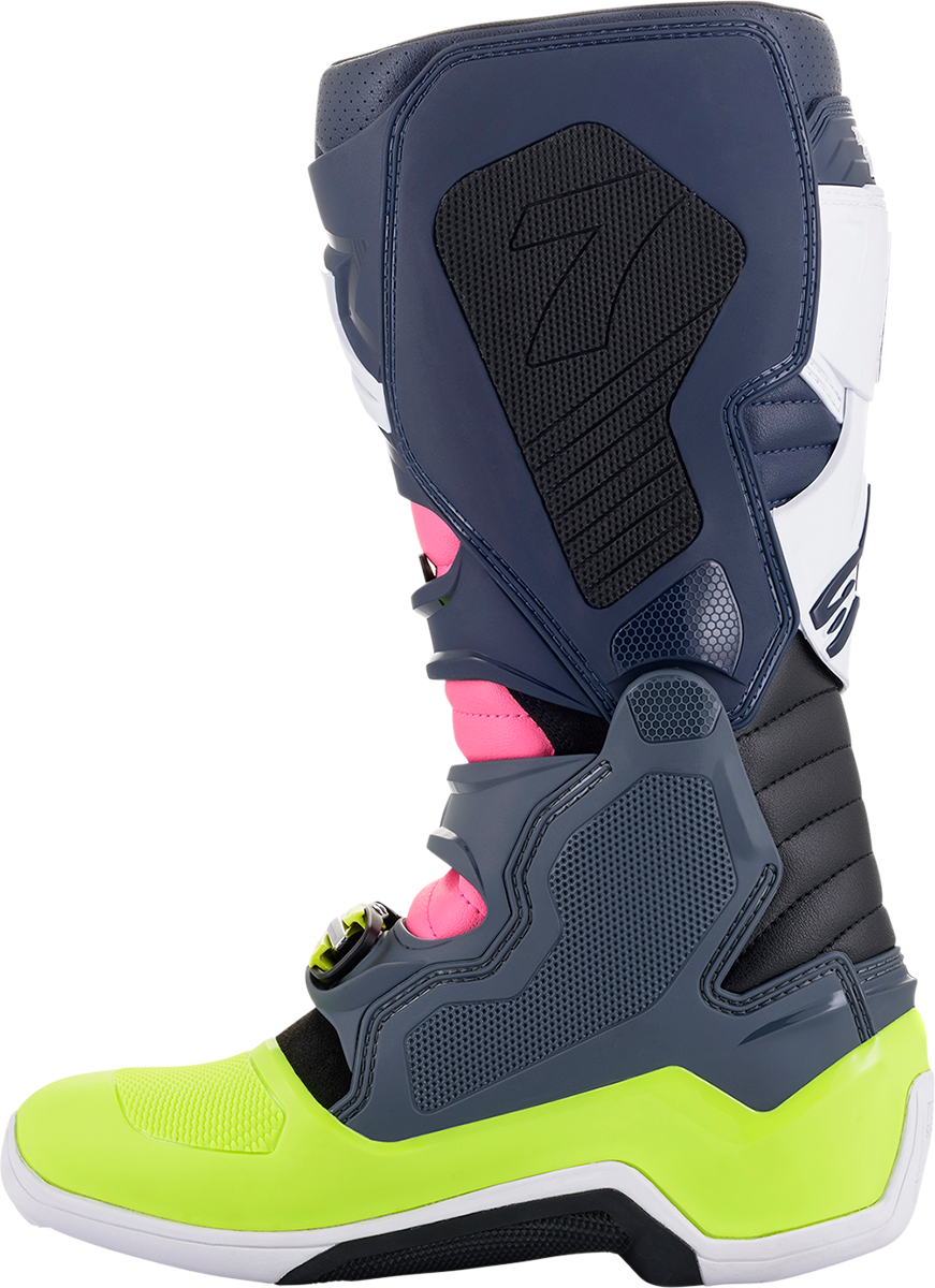 Alpinestars Tech 7 motorcycle boots in black, pink, white, and yellow with US size 10, featuring protective design and sturdy construction.