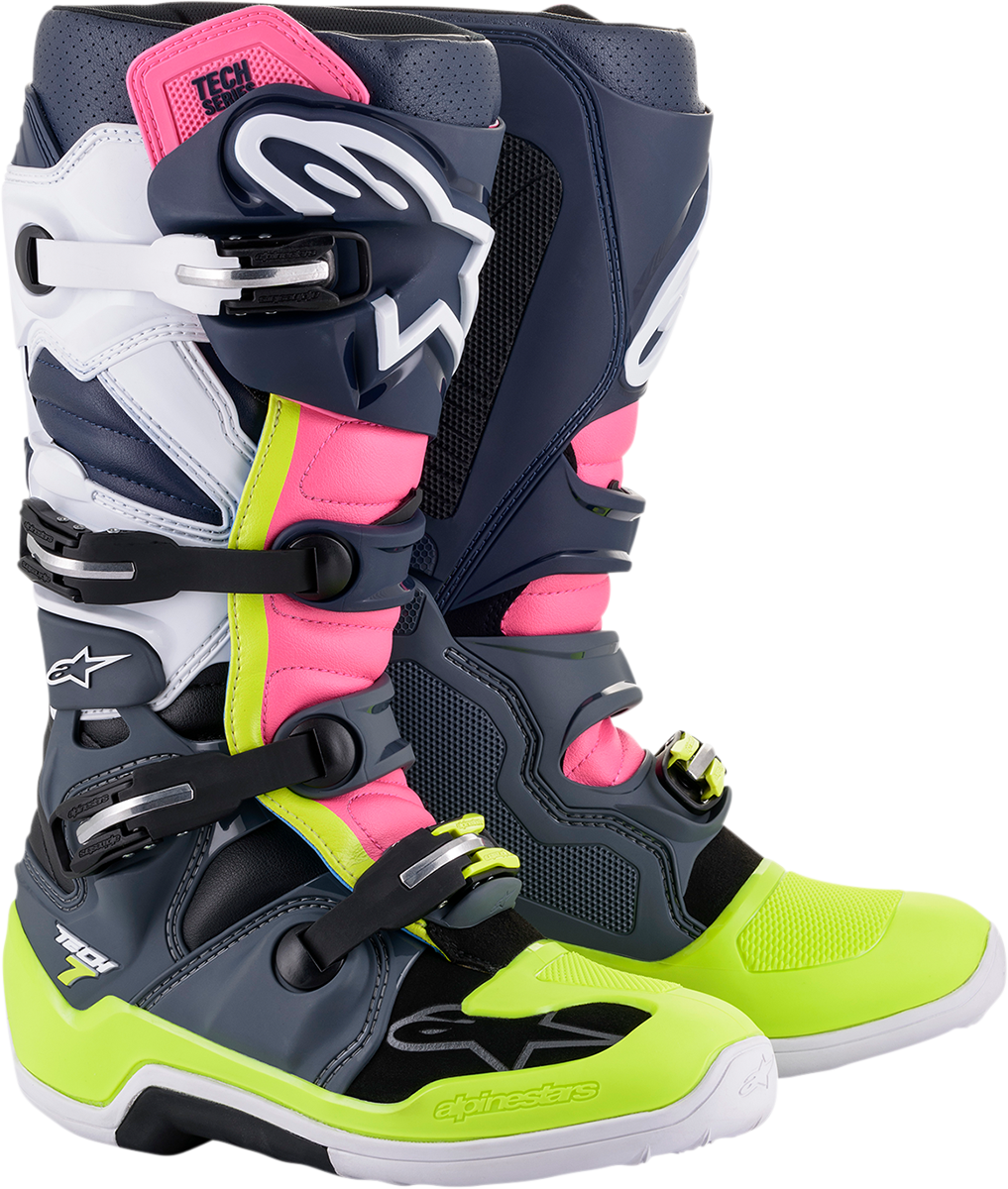 Alpinestars Tech 7 motorcycle boots in black, pink, white, and yellow with US size 11, featuring protective design and sturdy construction.