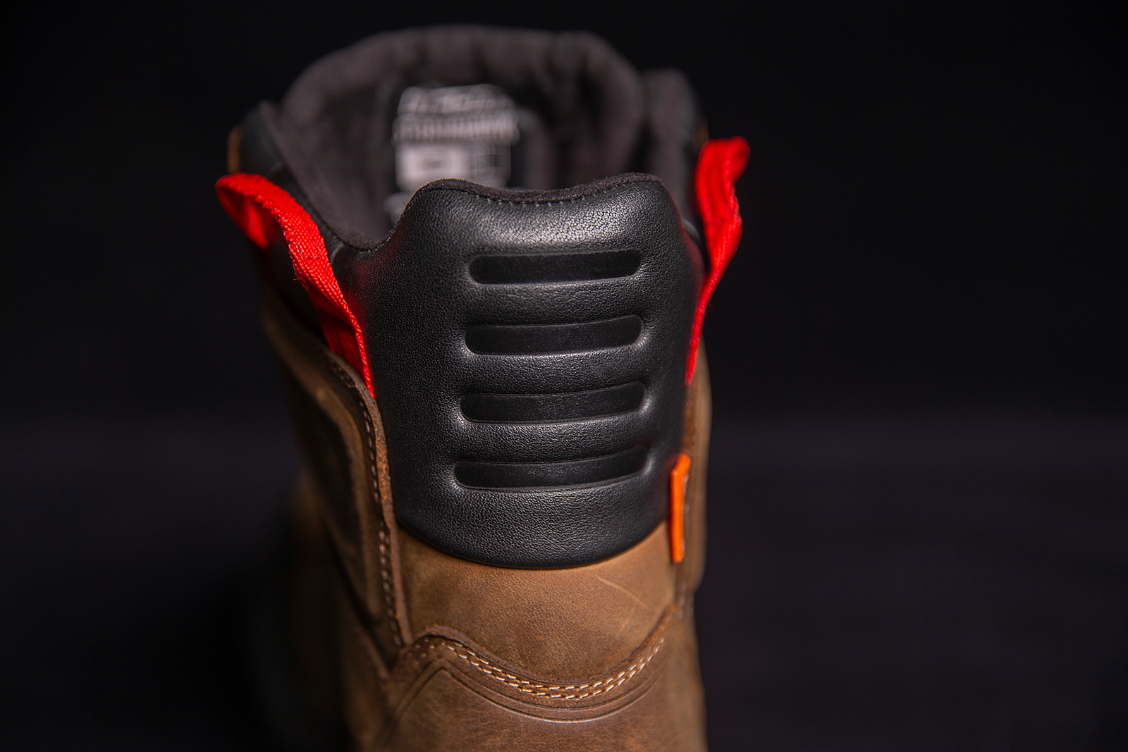 ICON Stormhawk boots in brown, size 11.5, by Bill's Exhausts, featuring rugged leather design and sturdy construction.