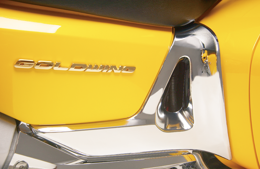 Chrome battery side cover trim for engine by Bill's Exhausts, model 52-630, showcasing a shiny, reflective chrome finish.