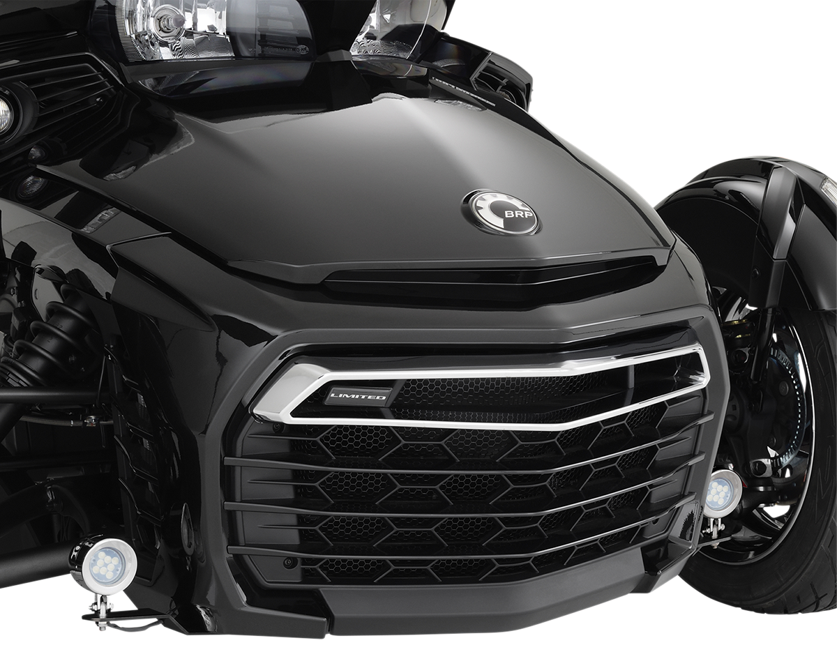 Chrome SHOW CHROME driving lights for 2015-2018 Spyder F3 engine by Bill's Exhausts, mounted on a motorcycle engine.
