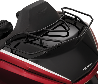 Black Show Chrome luggage rack mounted on a motorcycle engine, showcasing durable metal construction and sleek design.