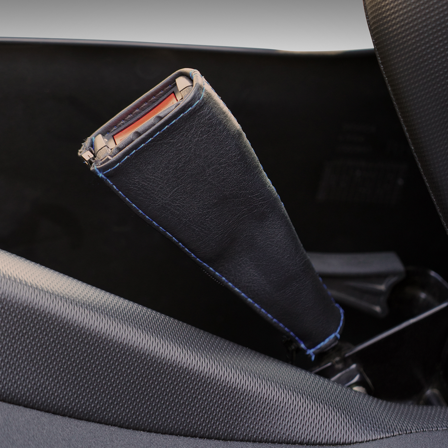 Show Chrome black seat belt covers with blue stitching, designed for engine safety and style by Bill's Exhausts.