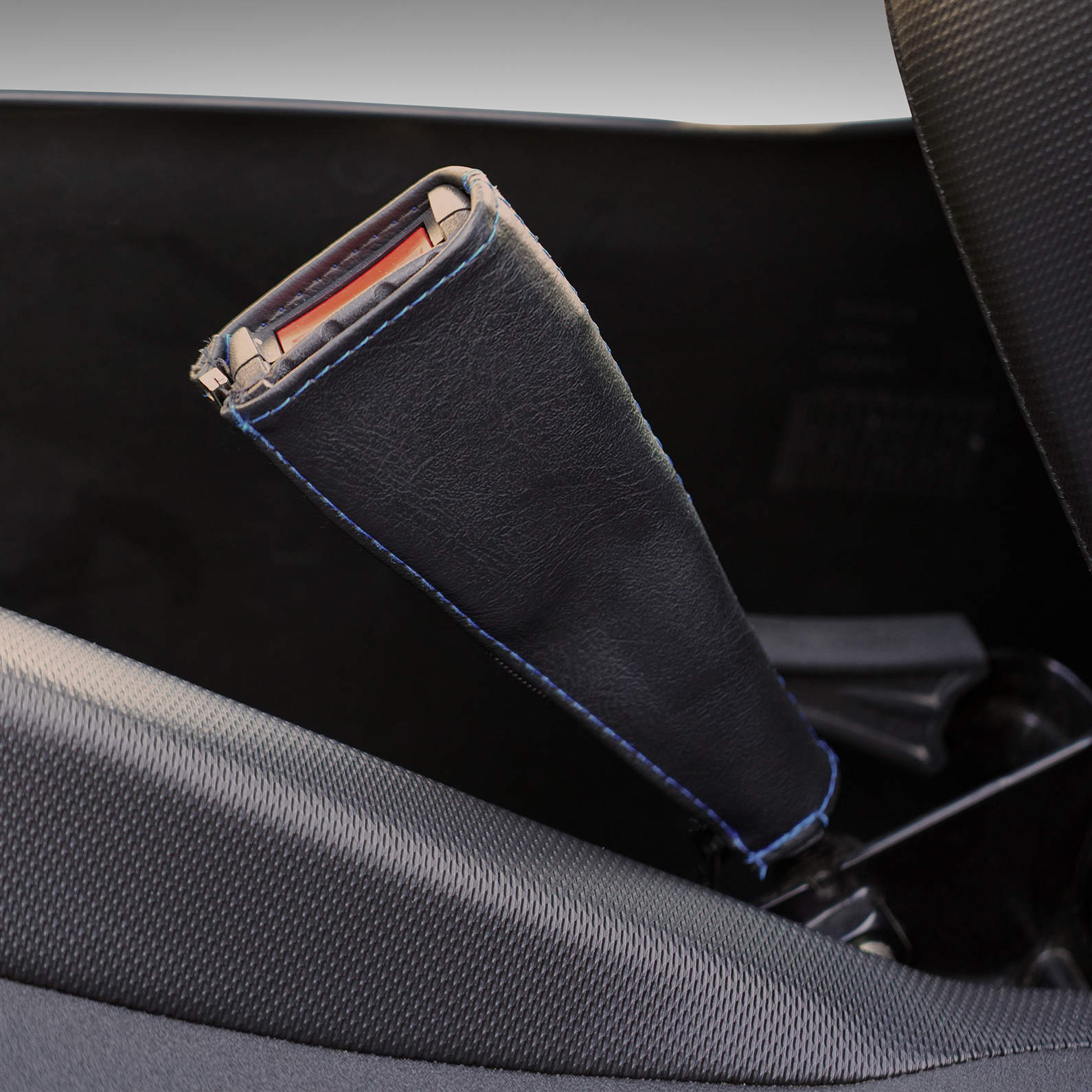 Show Chrome black seat belt covers with blue stitching, designed for engine safety and style by Bill's Exhausts.