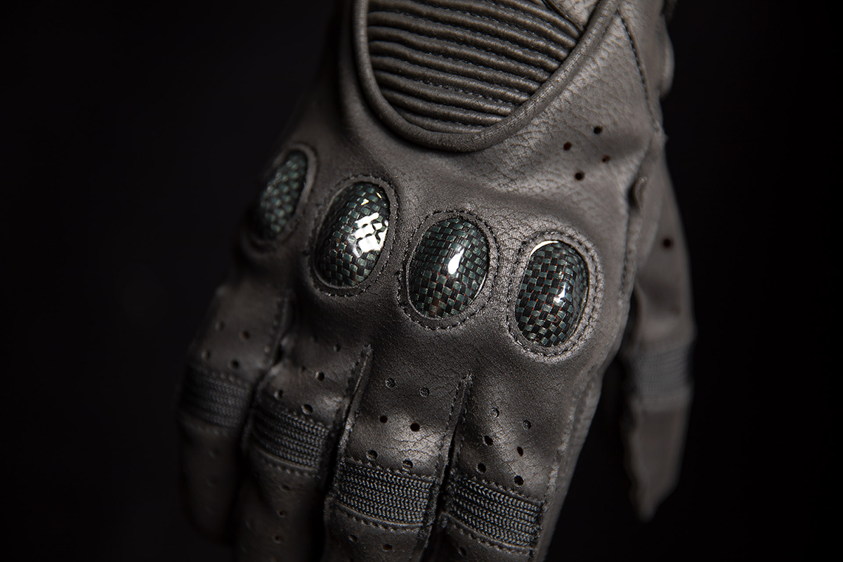Black ICON Outdrive™ gloves by Bill's Exhausts, small size, close-up of soft, durable motorcycle gloves with textured grip.
