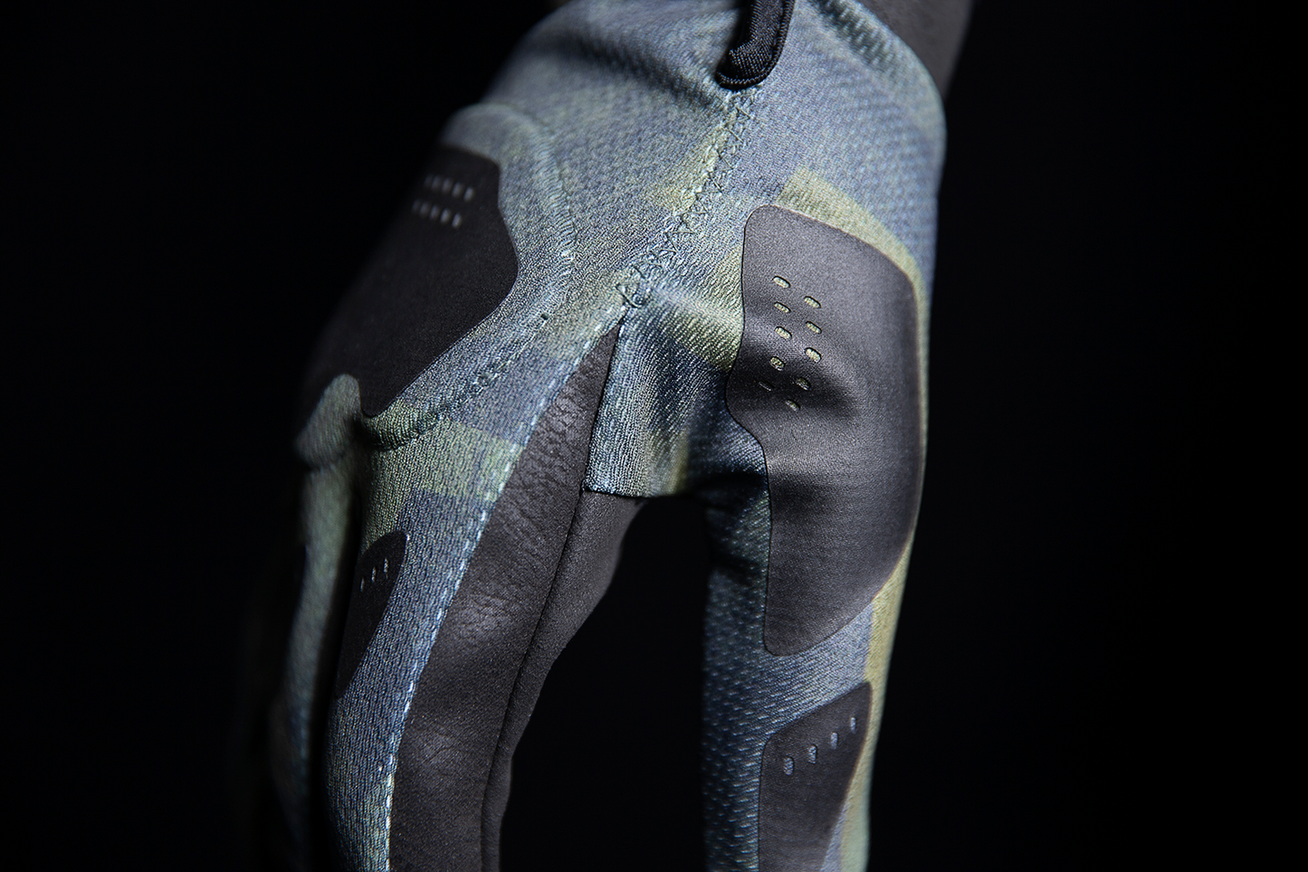 Open box green ICON Hooligan Battlescar gloves in medium size, showcasing rugged design and textured material from Bill's Exhausts.