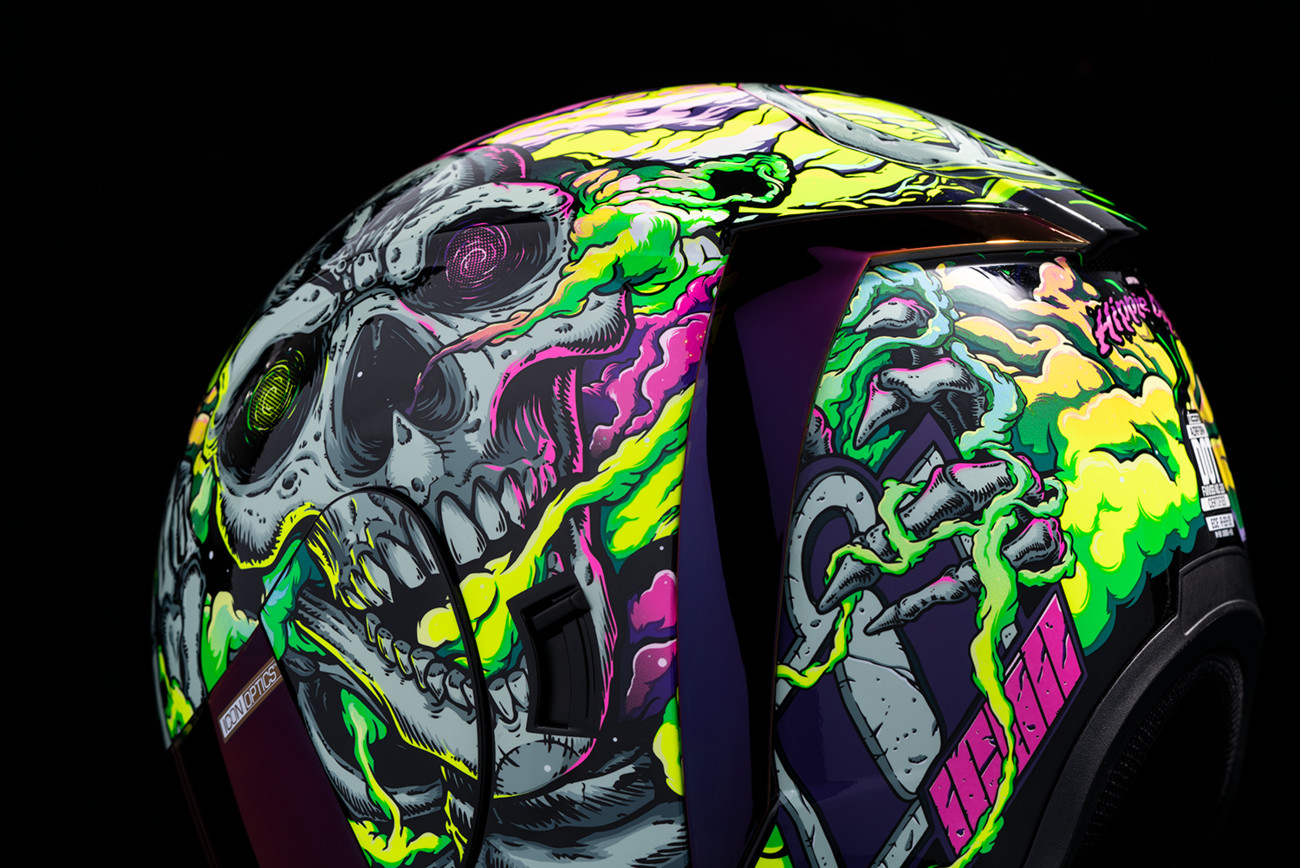 Purple ICON Airform™ Hippy Dippy helmet in large size, featuring a vibrant, psychedelic design with a secure helmet strap.