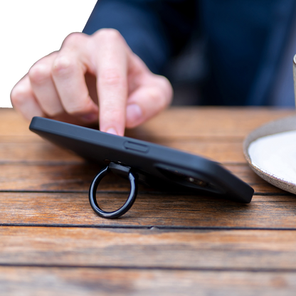 Black SP CONNECT phone mount ring attached to a device, designed for secure smartphone holding and easy access.