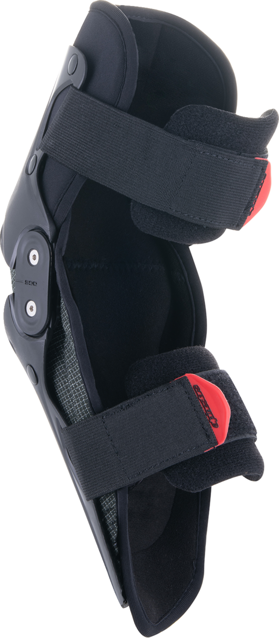 Alpinestars Youth SX-1 knee protectors in black and red, size L/XL, designed for protective gear in motocross or racing.