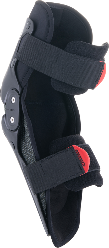 Alpinestars Youth SX-1 knee protectors in black and red, size L/XL, designed for protective gear in motocross or racing.