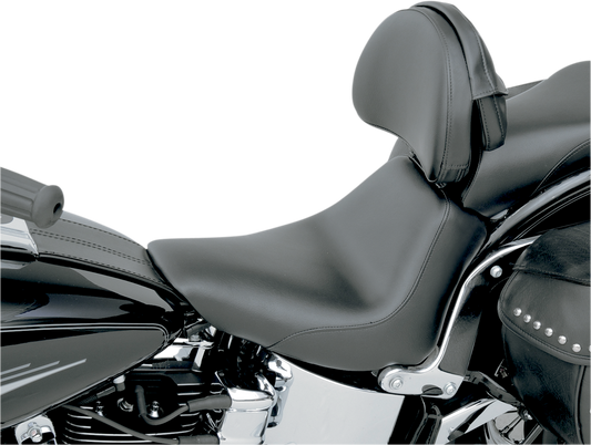 Black Saddlemens Heels Down Solo Seat with backrest for FXST motorcycle, featuring a plain design and cushioned seating.