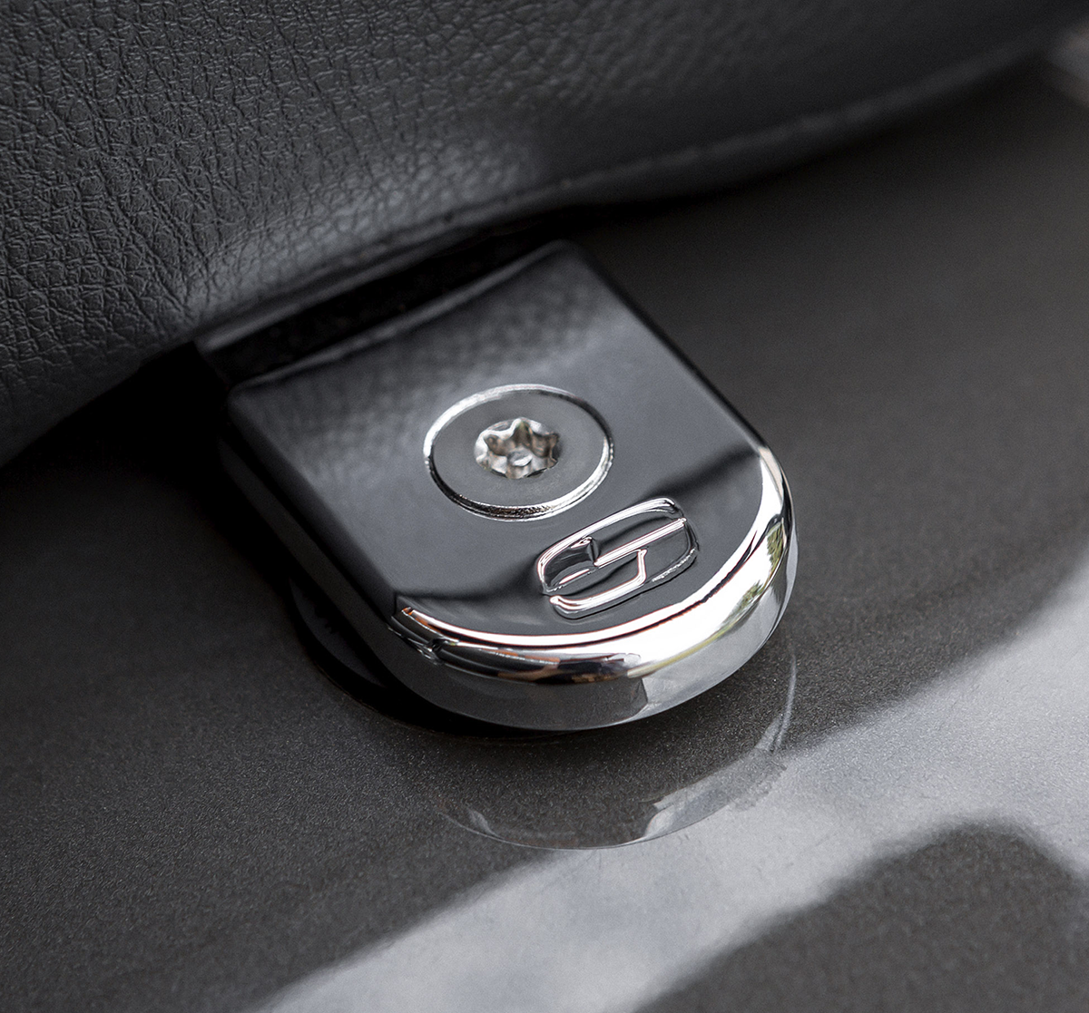 Chrome Saddlemen Security Seat Screw for motorcycle seats, designed for secure attachment and durability.