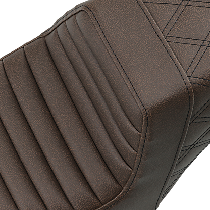 Brown Saddlemen Step-Up Seat with front tuck-n-roll and rear lattice stitch for motorcycle, designed for comfort and style.