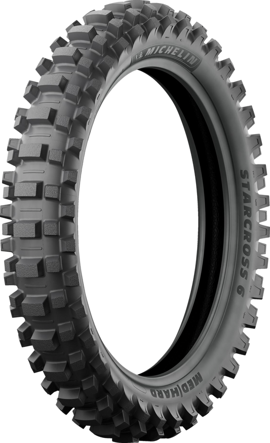 Rear Michelin StarCross 6 Medium Hard tire for motocross bikes, size 120/90-18, with tread pattern visible.