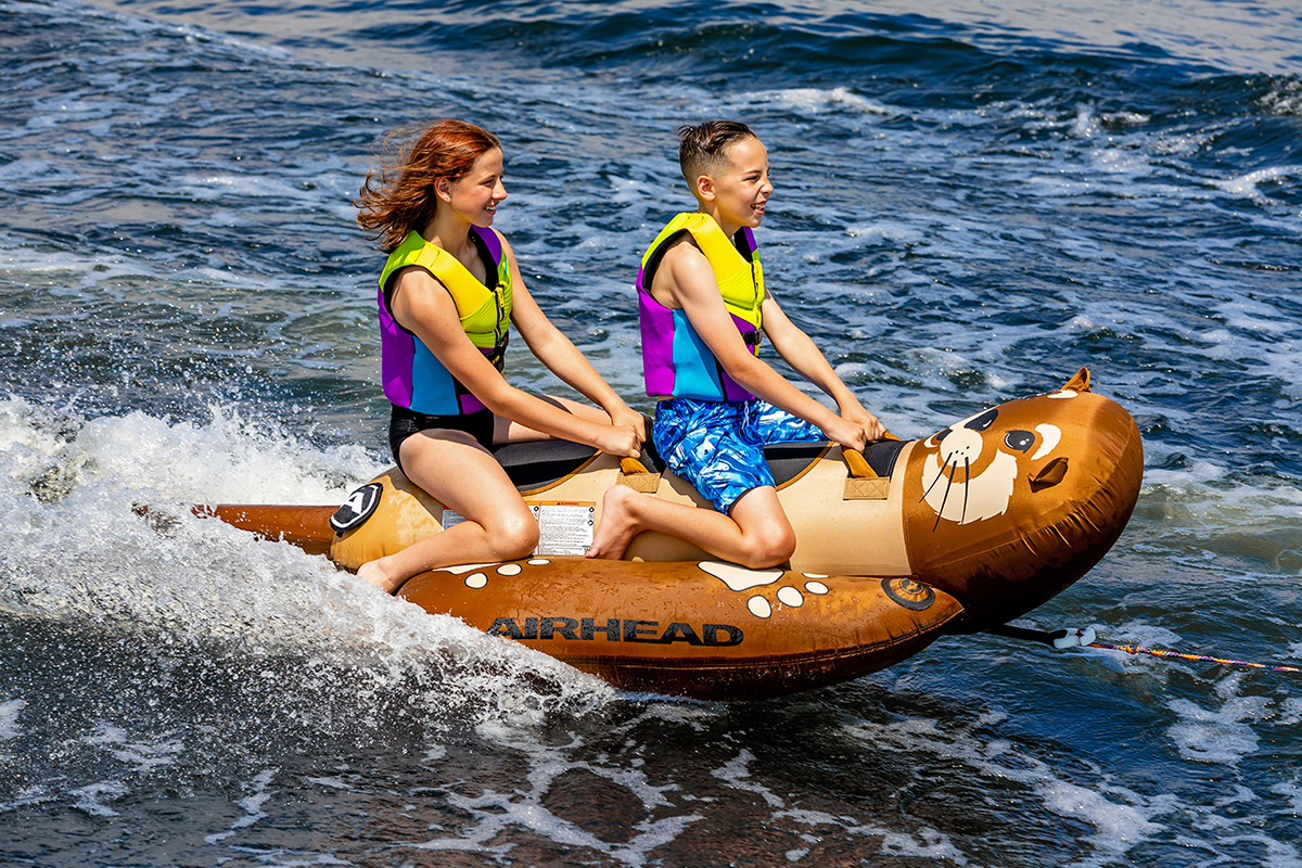 Airhead Sports Group Otter riding tube by Bill's Exhausts, a colorful inflatable towable water tube for water sports fun.
