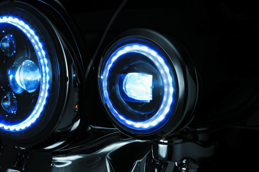 Kuryakyn 4.5-inch Vision Passing Lamps mounted on Indian Chieftain motorcycle, showcasing their sleek design and bright illumination.