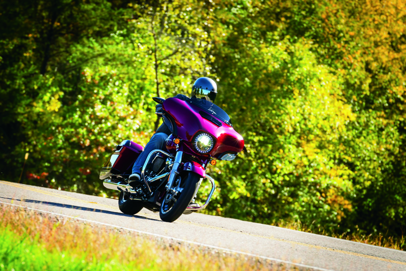 Kuryakyn Smooth Windshield Trim for Harley Davidson Touring models, shown in polished metal finish with sleek design