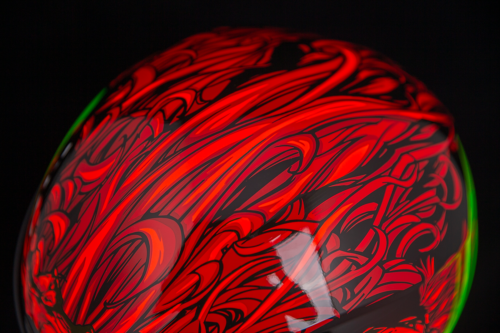 Red ICON Airform™ helmet for men, medium size, featuring a sleek aerodynamic design and ventilation system.