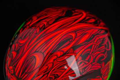 Red ICON Airform™ helmet for men, medium size, featuring a sleek aerodynamic design and ventilation system.