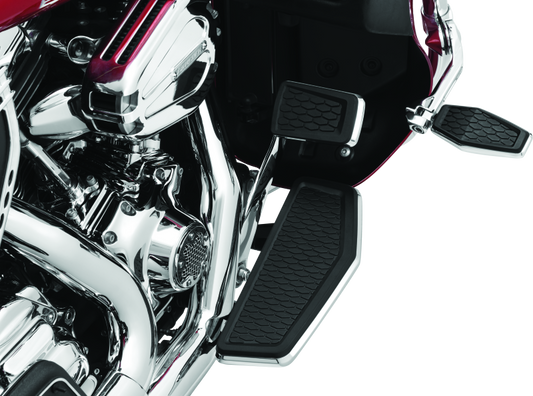Chrome Kuryakyn Hex Brake Pedal Pad for Harley Davidson Touring models, featuring a distinctive hex design.