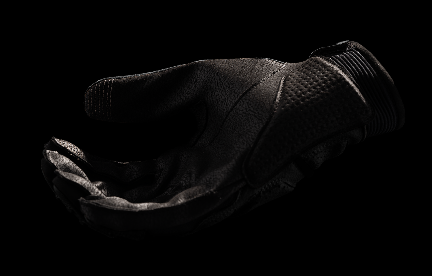 Black ICON Women's Superduty3™ Gloves in Medium size, showing the durable fabric and secure wrist strap.
