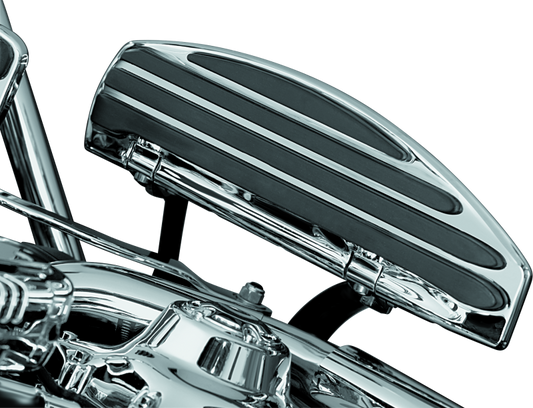Kuryakyn running board extensions installed on a Harley-Davidson Touring motorcycle, showing the chrome finish and mounting details.
