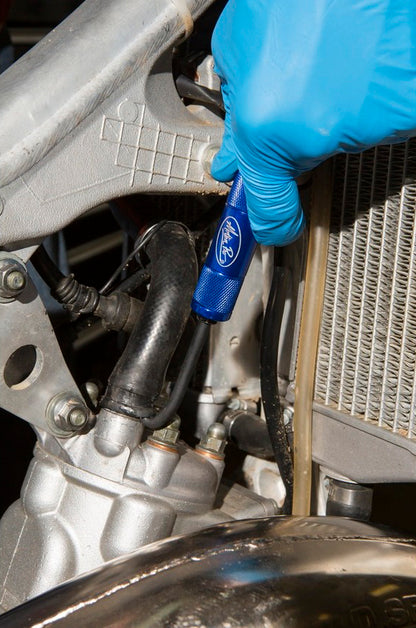 Motion Pro Hose Removal Tool 08-0646 for safe and easy motorcycle hose disconnection, shown in use on a motorcycle hose.