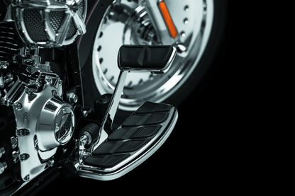 Kuryakyn Kinetic brake pedal pad in chrome for Harley Davidson Touring models, showing the textured surface and sleek finish