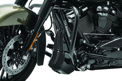 Black Kuryakyn oil cooler cover for Harley Davidson Touring models, part #6418, shown installed on motorcycle engine area.