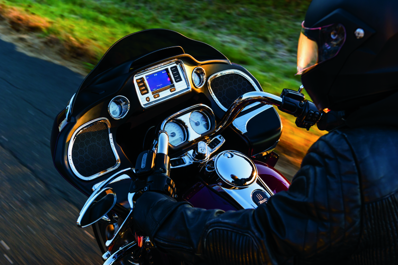 Chrome Kuryakyn push-button fuel door latch for Harley-Davidson Touring bikes, featuring a sleek, durable design.