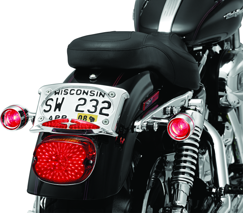 Kuryakyn Deep Dish Bezel with Red Lens for Harley-Davidson Bullet Turn Signals, part #2109, showing the red lens and bezel design