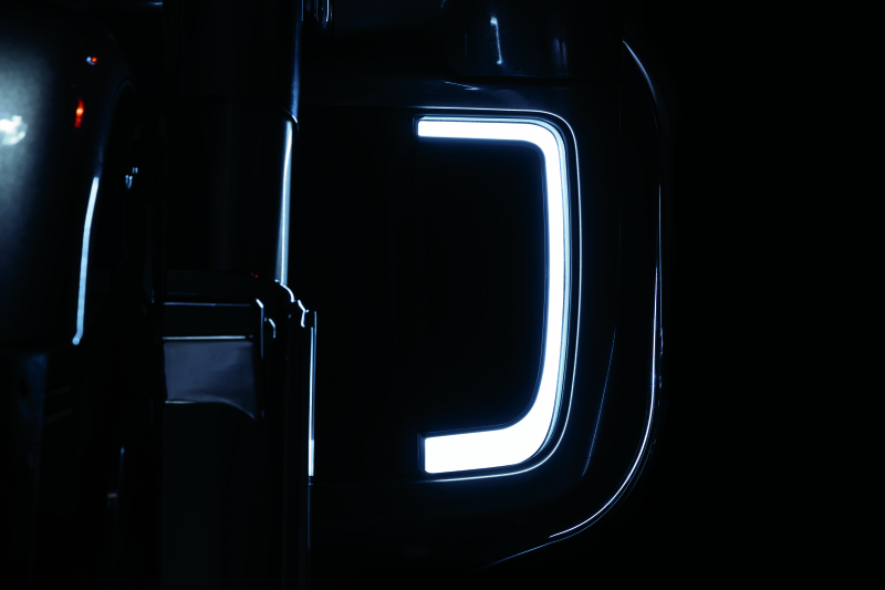 Black Kuryakyn Tracer Lower Fairing Grill for Harley Davidson Touring models, showcasing the sleek design and finish.