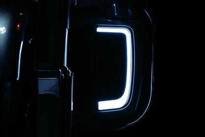 Black Kuryakyn Tracer Lower Fairing Grill for Harley Davidson Touring models, showcasing the sleek design and finish.