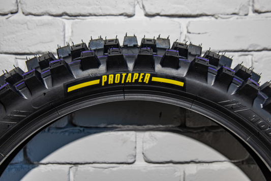 ProTaper MXT 04 rear motorcycle tire 120/80-19 for off-road riding, featuring durable tread pattern and rugged sidewalls.