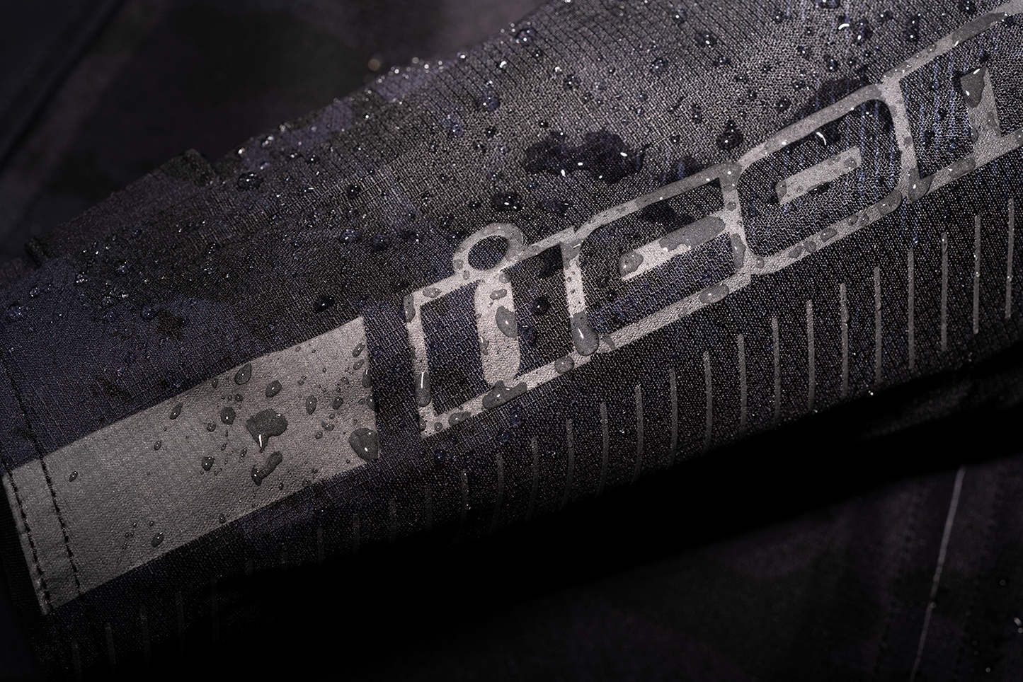 Dark camouflage ICON PDX3™ jacket by Bill's Exhausts, large size, featuring a stylish camouflage pattern and jacket design.