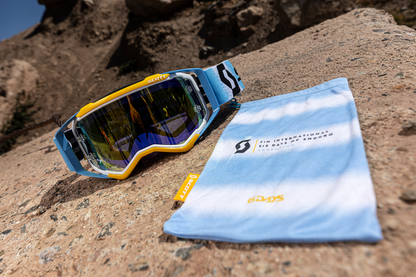 Scott Prospect motocross goggles in white and blue with yellow accents, featuring a sleek design and clear lens.