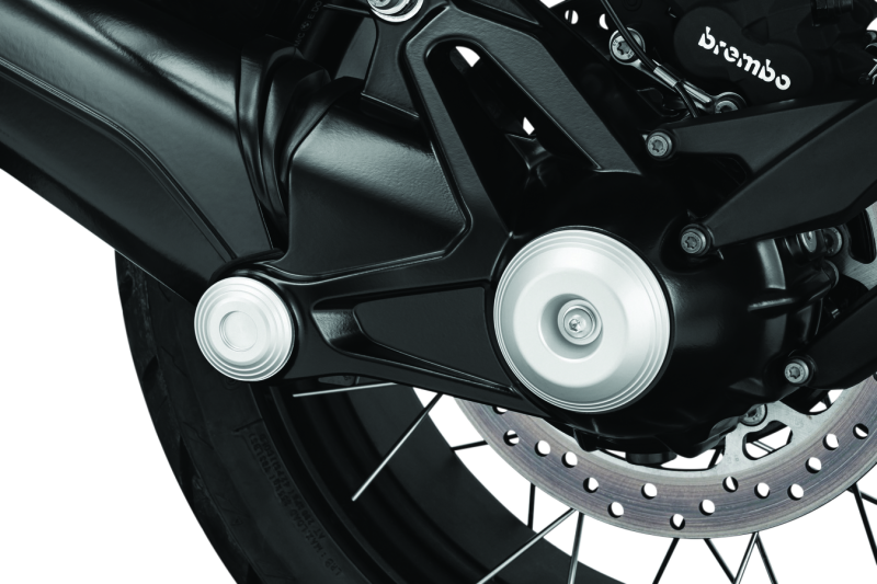 Kuryakyn Lodestar front axle sliders on BMW R1200GS and R Nine T protect suspension and brake components during falls or impacts.