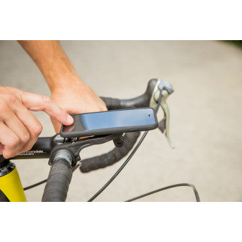 Black SP CONNECT handlebar phone mount attached to a motorcycle handlebar, showcasing secure mounting for smartphone devices.