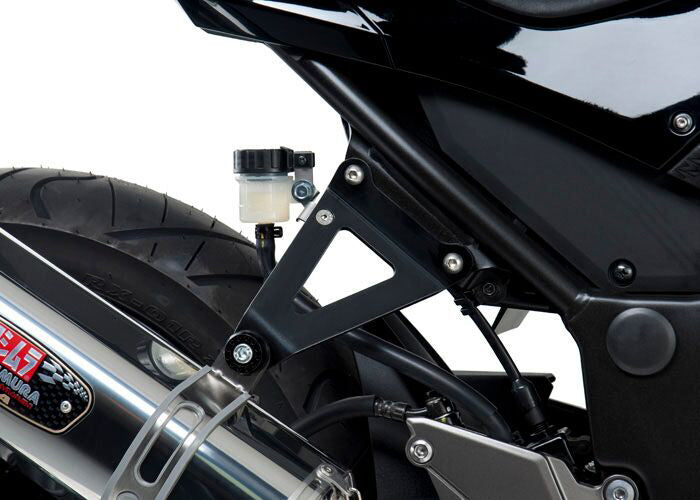 YOSHIMURA Yoshimura muffler bracket for Ninja 300, lightweight aluminum exhaust mount with part number 14700AB, shown on motorcycle.