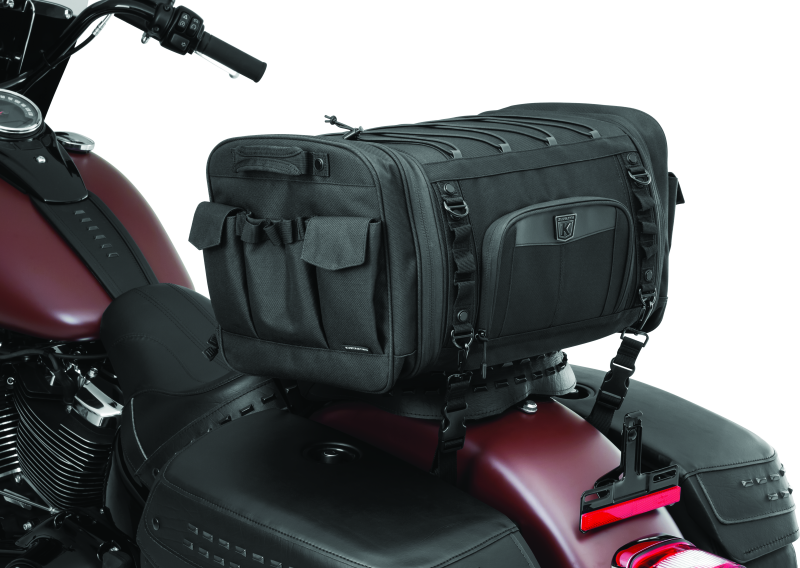 Kuryakyn Momentum Drifter Bag 42-liter luggage for powersports adventures, shown in black with adjustable straps and multiple compartments.