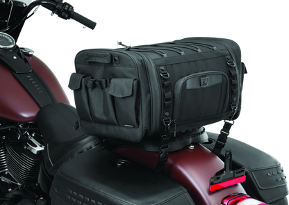 Kuryakyn Momentum Drifter Bag 42-liter luggage for powersports adventures, shown in black with adjustable straps and multiple compartments.