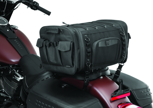 Kuryakyn Momentum Drifter Bag 42-liter luggage for powersports adventures, shown in black with adjustable straps and multiple compartments.